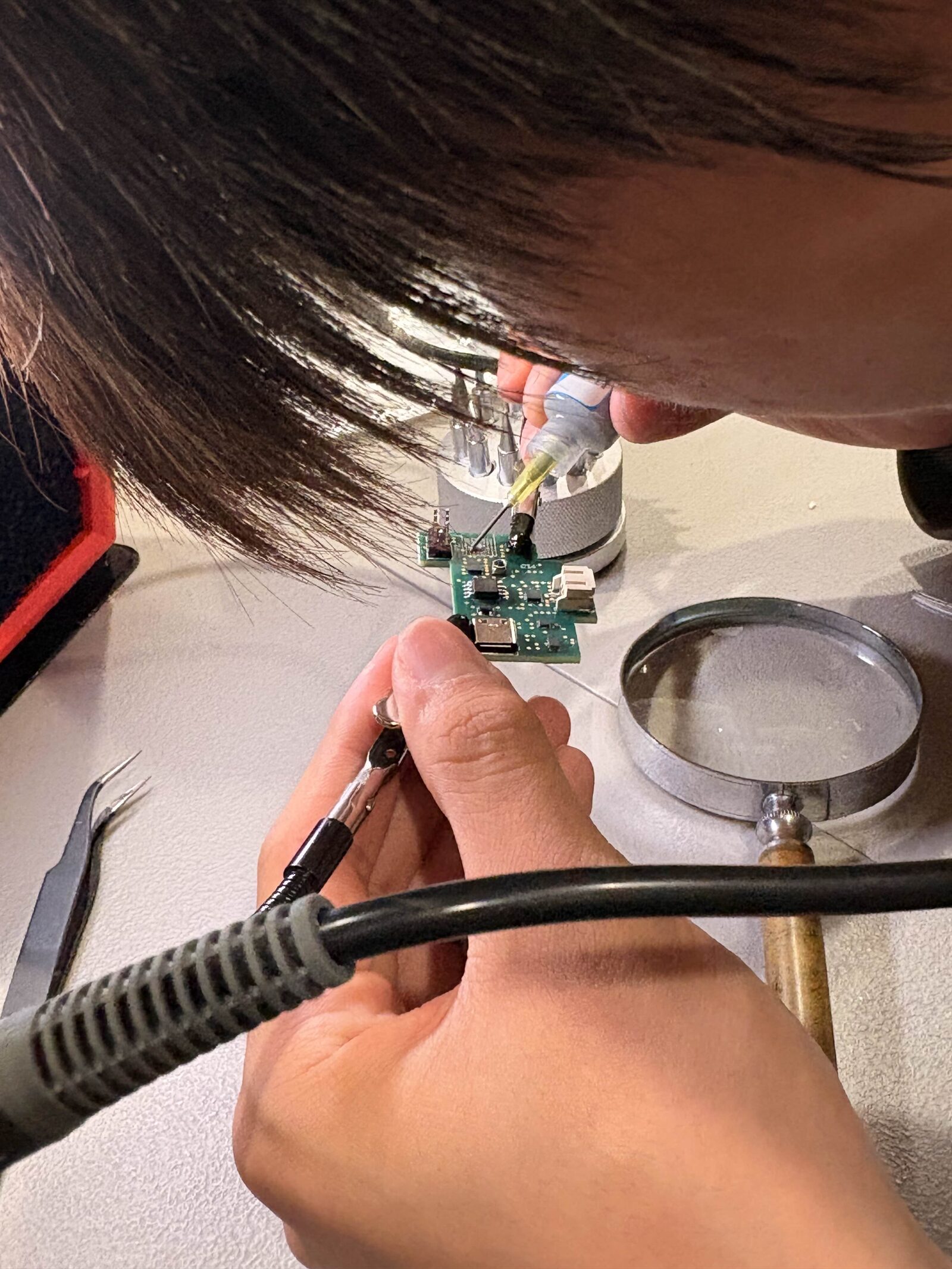 Ryan hand-soldering the BLE module on Slingshot V1